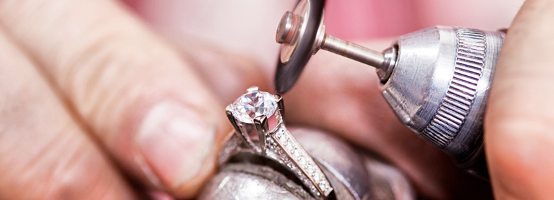 Jeweller mending a diamond ring
